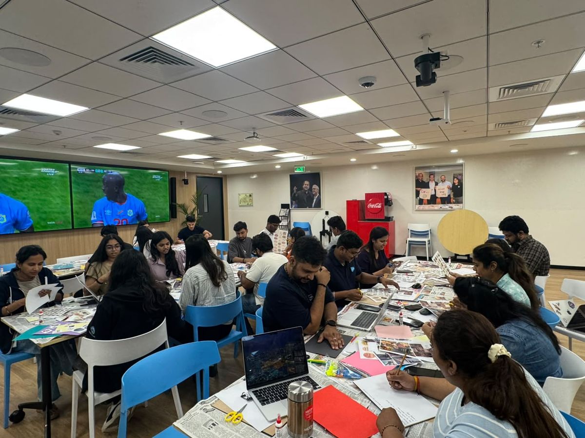 A team making collages at an office workshop